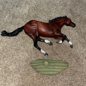 3 Breyer traditional and 1 classic model horses.
